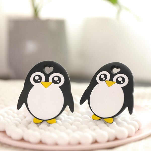 Svarte og hvite silikonfigurer formet som pingviner
